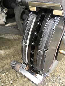 Brake pad sticking out 1/8&quot; outward from rotor, safe?-4uqcoa2.jpg