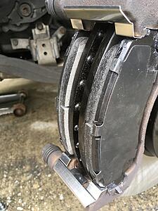 Brake pad sticking out 1/8&quot; outward from rotor, safe?-ig1yohd.jpg