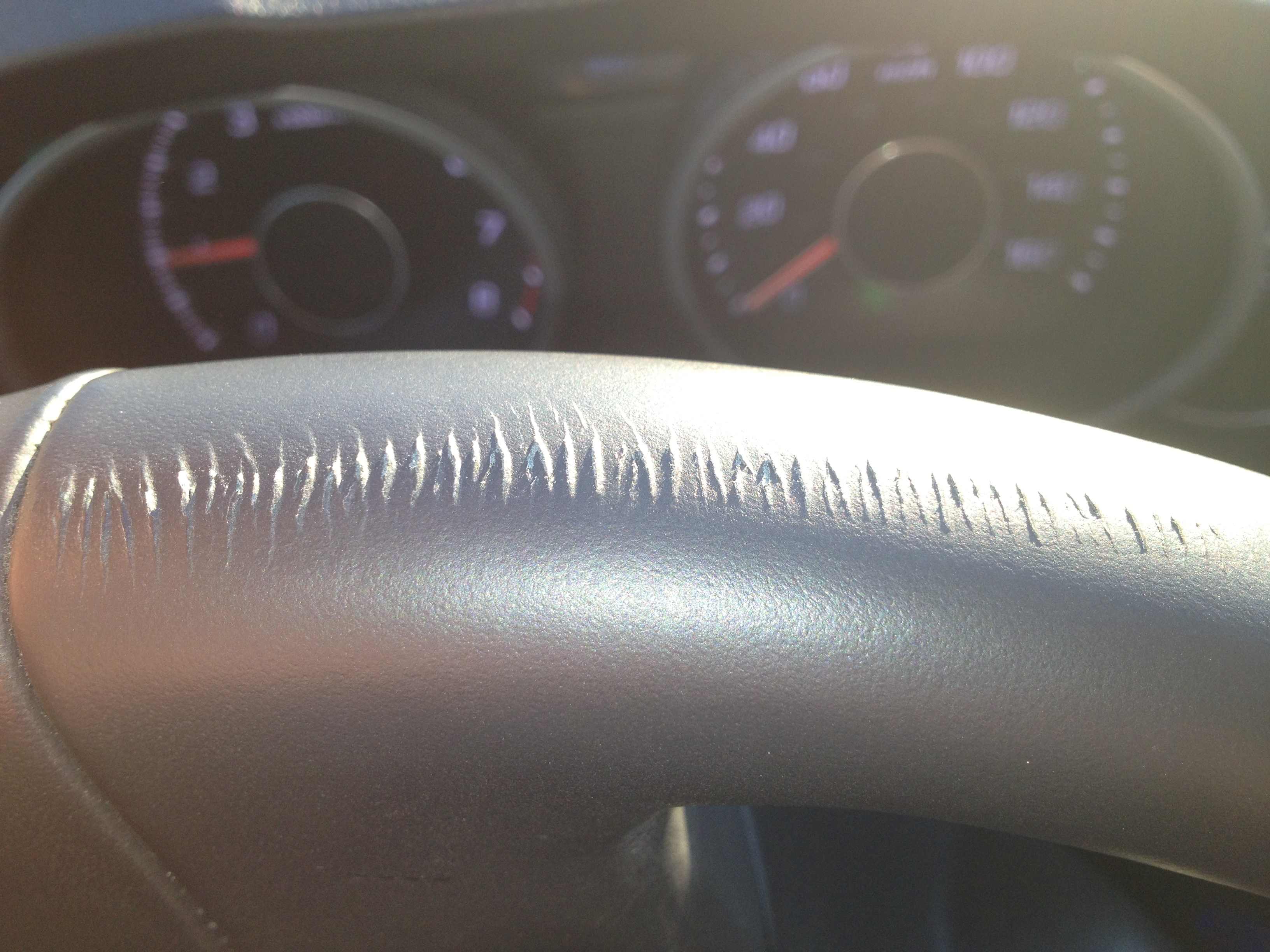 How could I fix a small scratch on leather wrapped steering wheel?